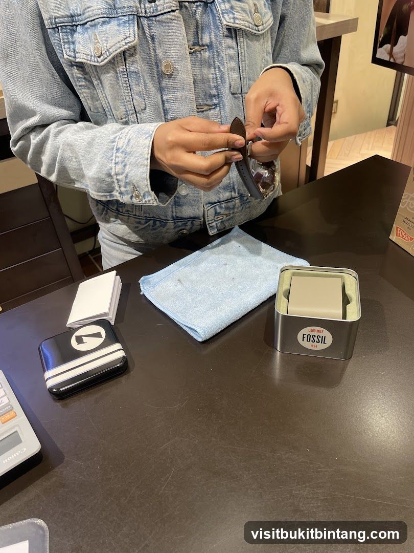 Person examining a watch