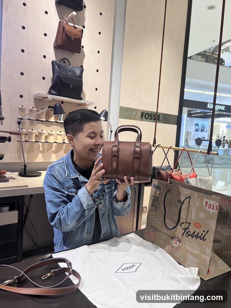 Woman holding a Fossil handbag