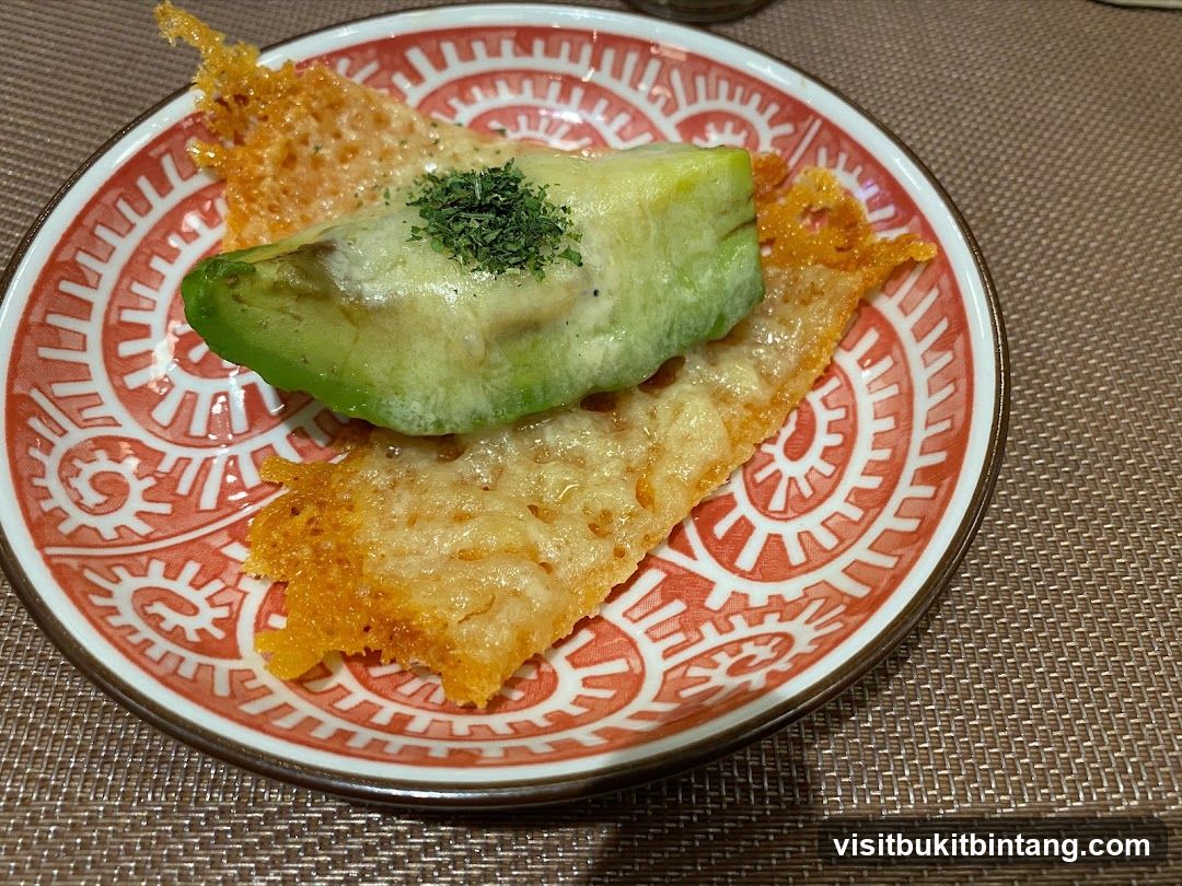 Avocado and Cheese Crisps on Patterned Plate