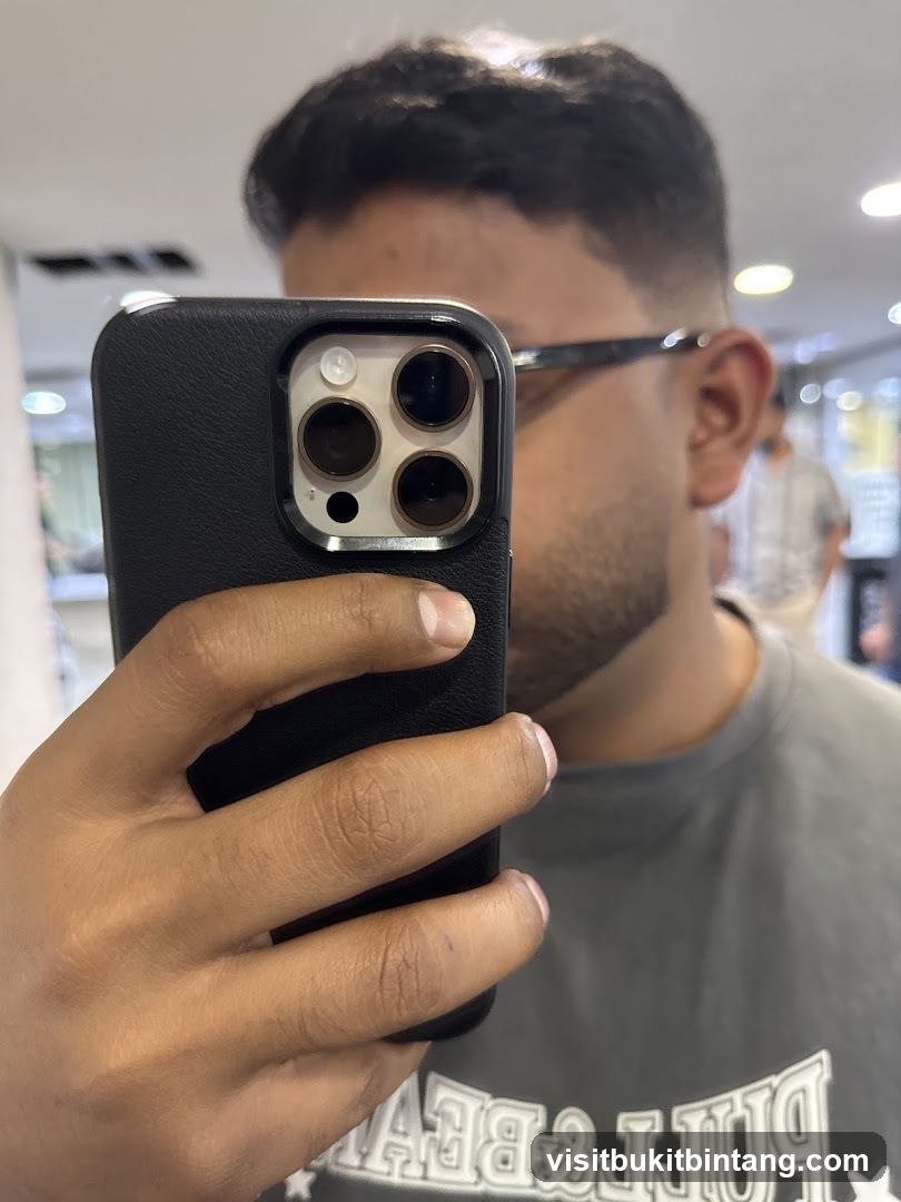 Mirror selfie with phone in hand