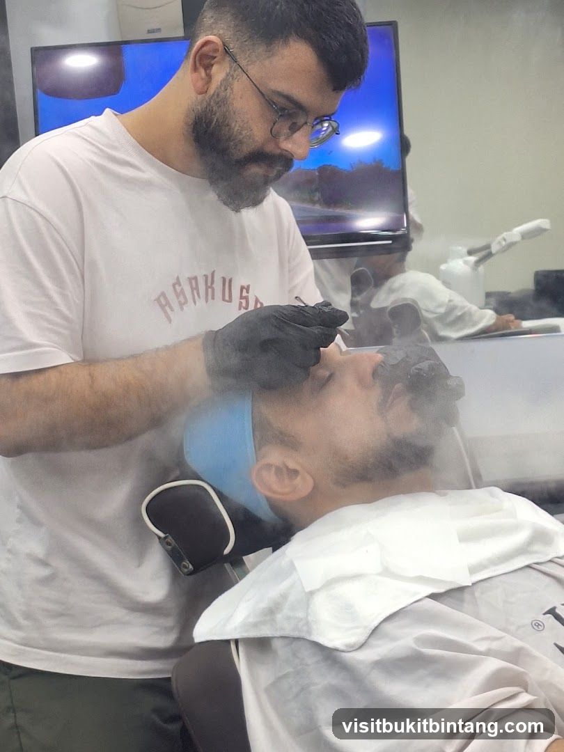 Barber performing facial treatment