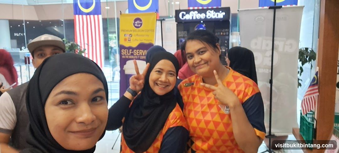 People Posing at a Coffee Booth