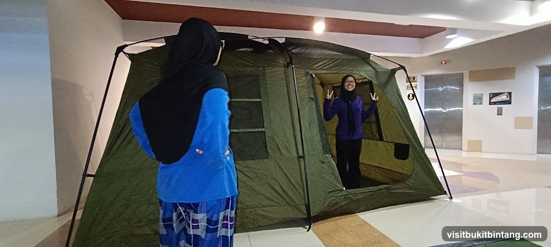 Two people with a tent