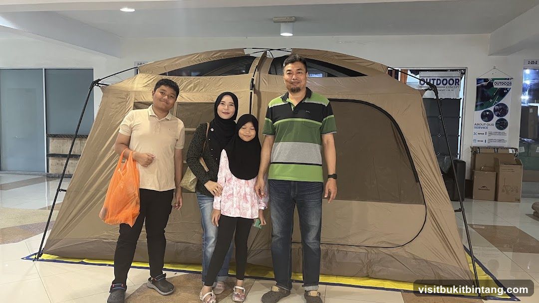 Family Poses in Front of a Tent