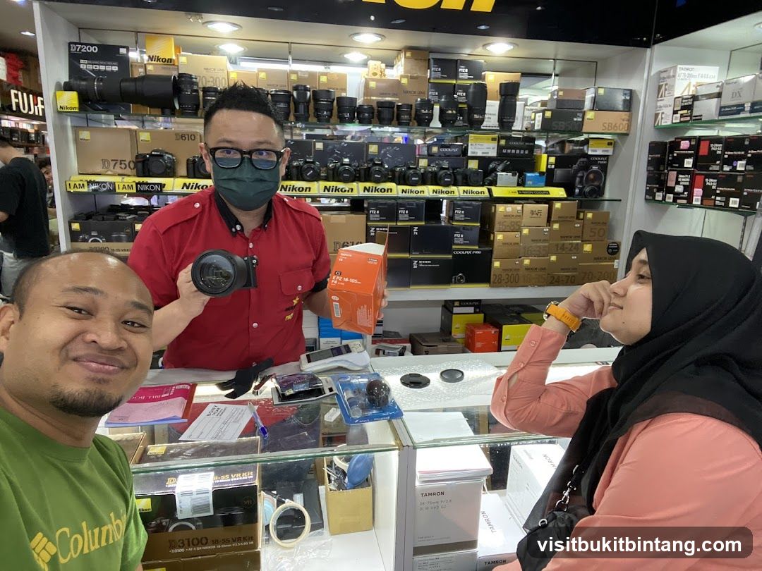 Camera Shop Interior with Staff and Customer