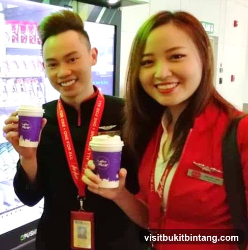 Two people holding coffee cups