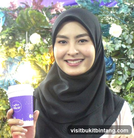 Woman holding a coffee cup