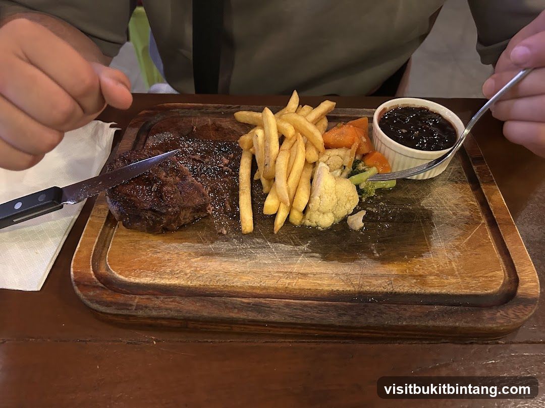 Steak and Fries on Wooden Board