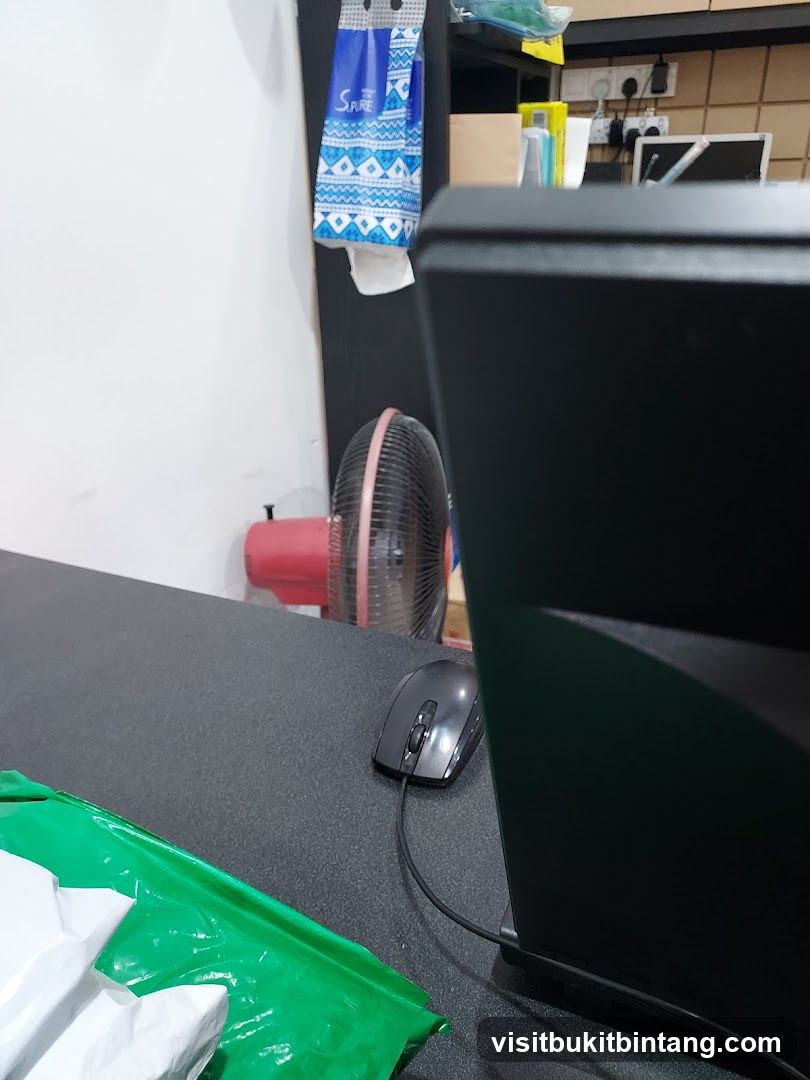 Desk with Computer Peripherals and Packaging