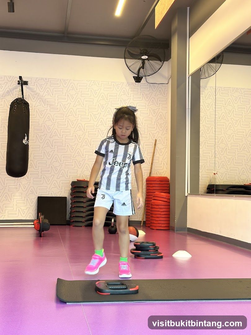Young girl training in a gym
