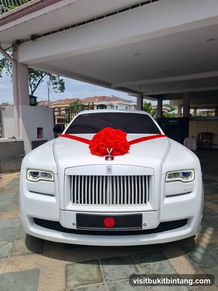 White Rolls-Royce with Red Bow