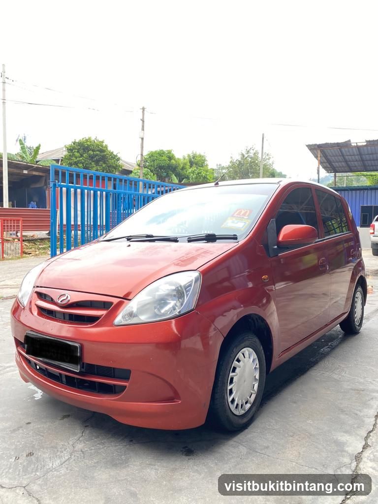 Red Toyota Yaris parked outside
