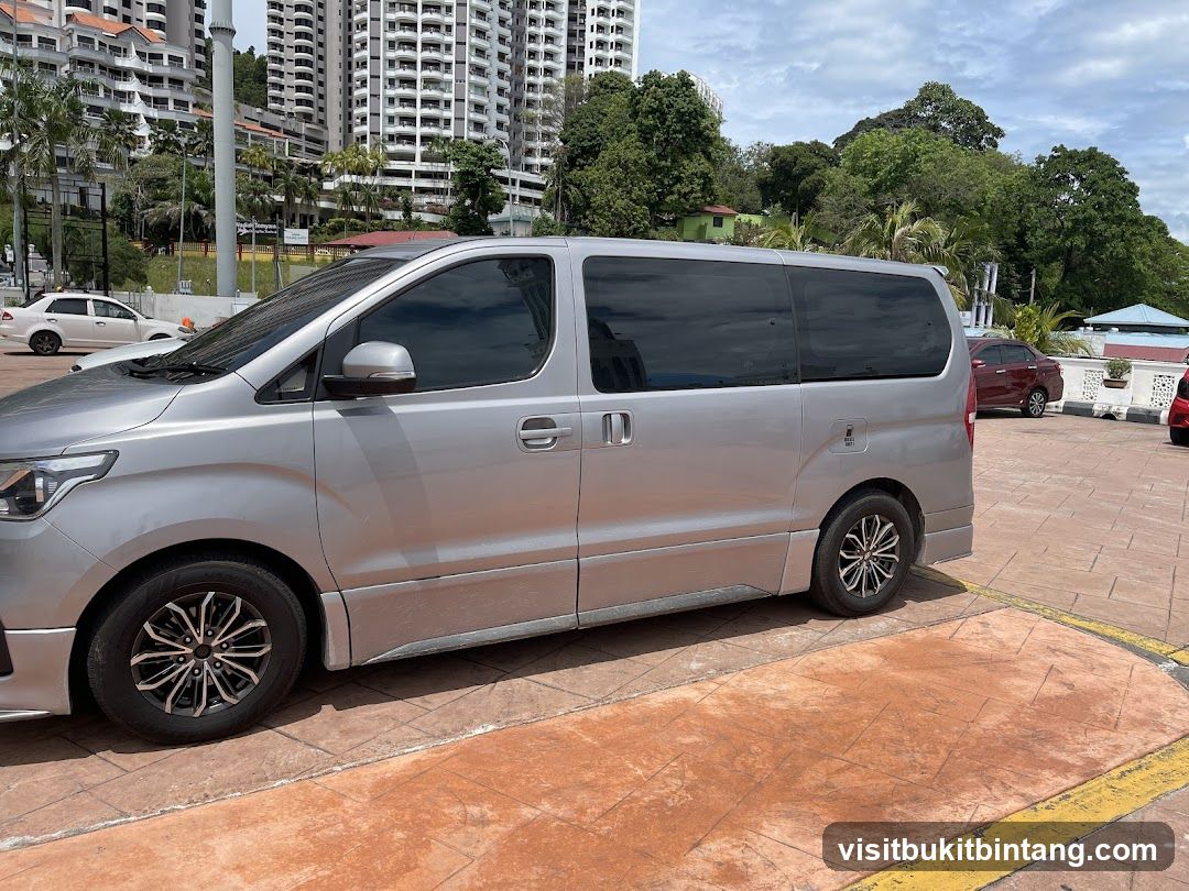 Silver Minivan Parked in Lot