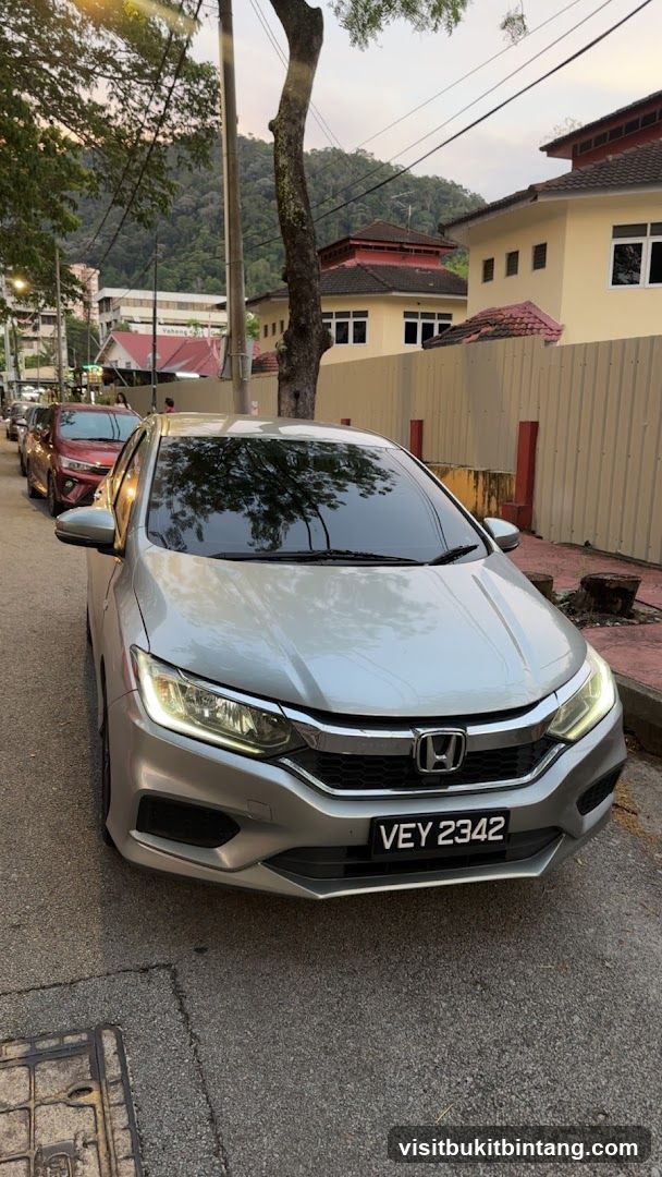 Silver Honda parked on street