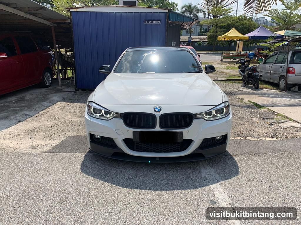White BMW parked in lot