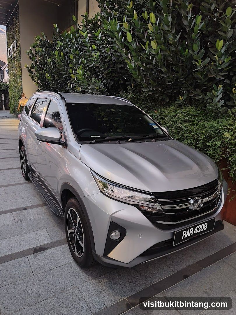 Silver SUV parked outside building