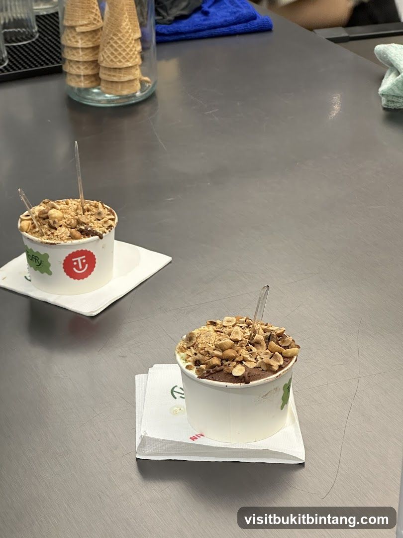 Two cups of gelato with toppings