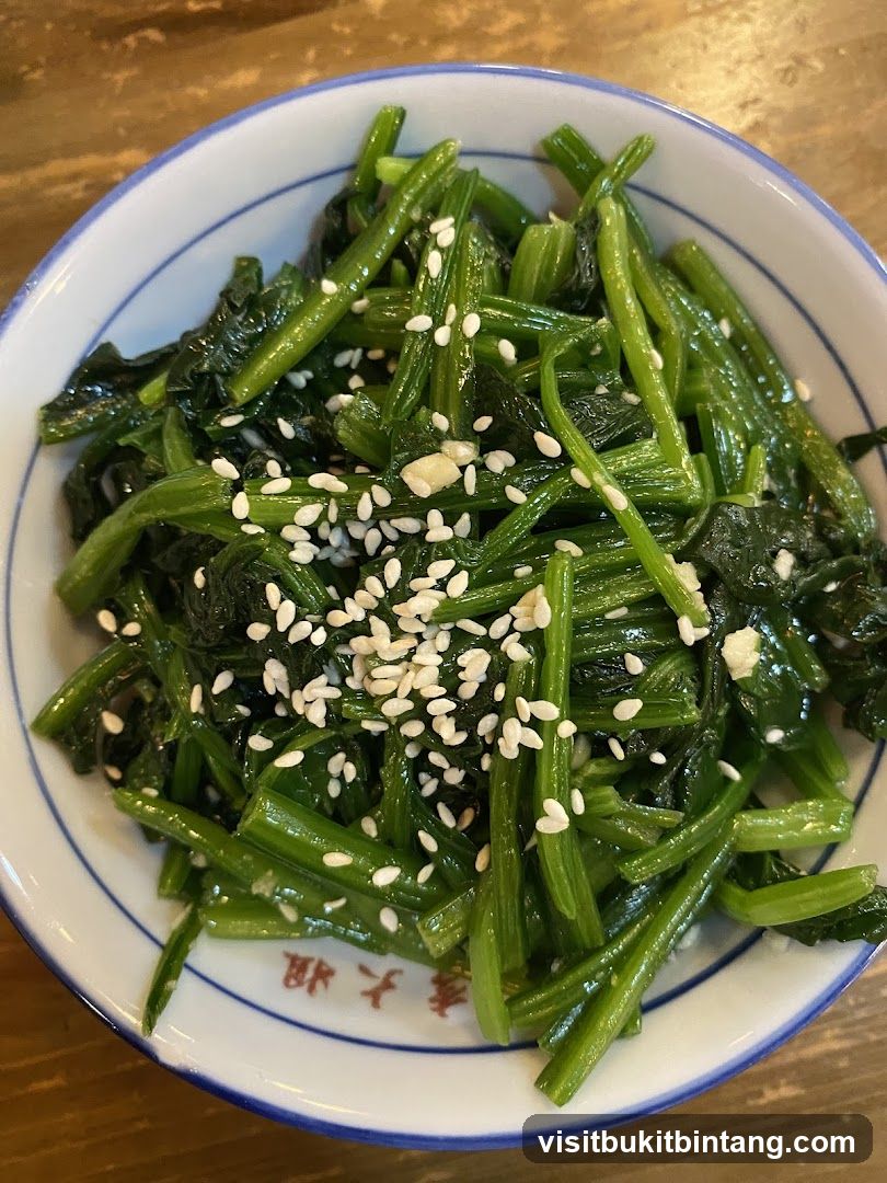 Stir-fried greens with sesame seeds
