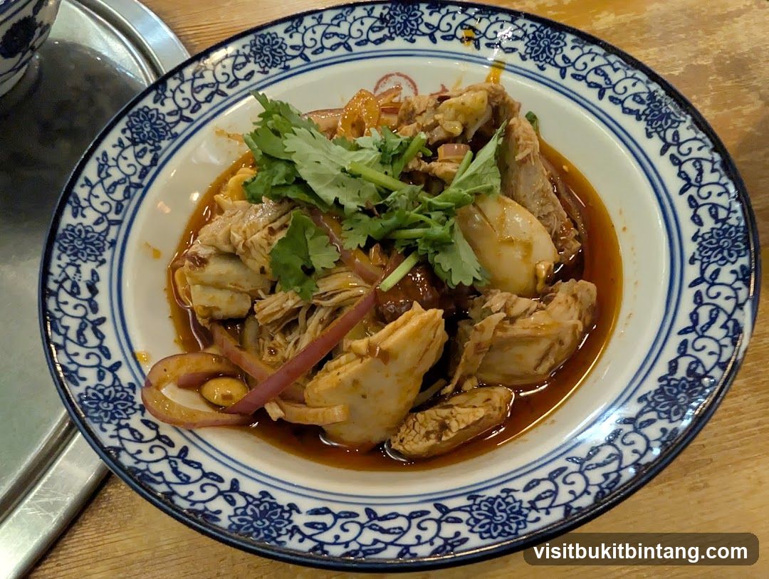 Bowl of Spicy Chicken with Cilantro and Onions