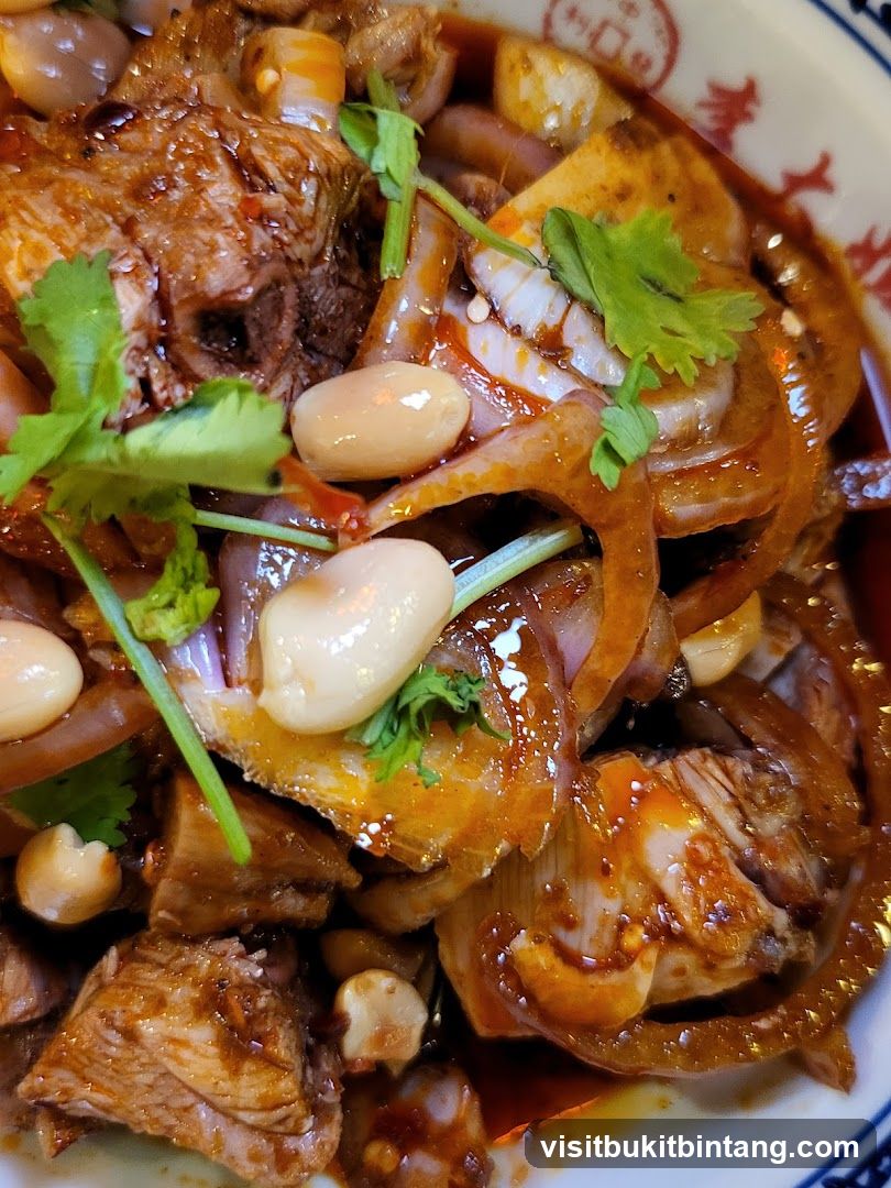 Spicy Braised Meat Dish with Peanuts and Cilantro