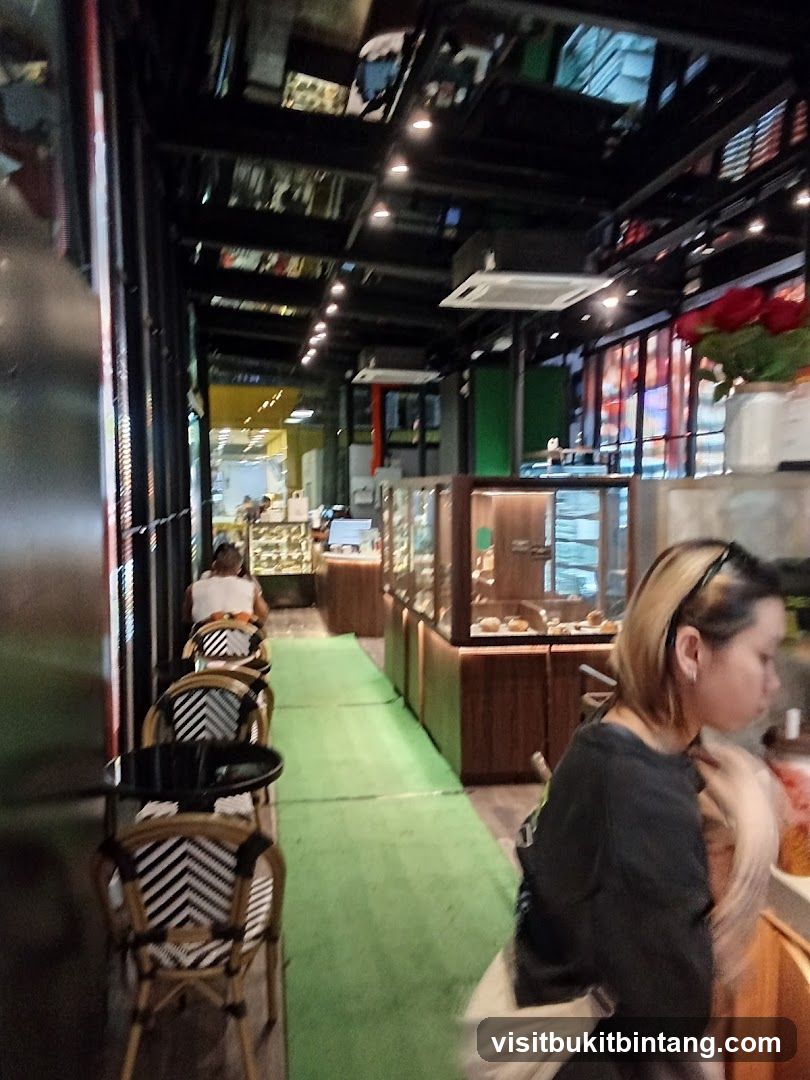 Interior of a cafe with seating and display cases
