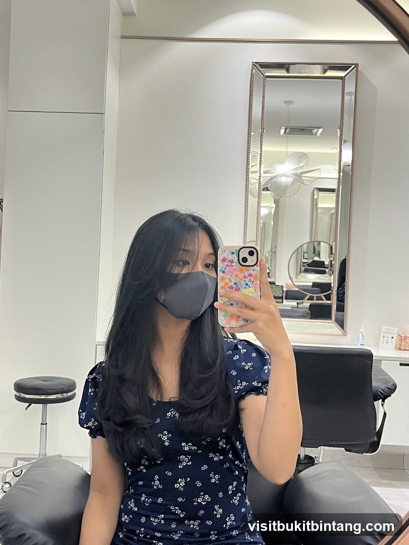 Woman taking a selfie in a salon