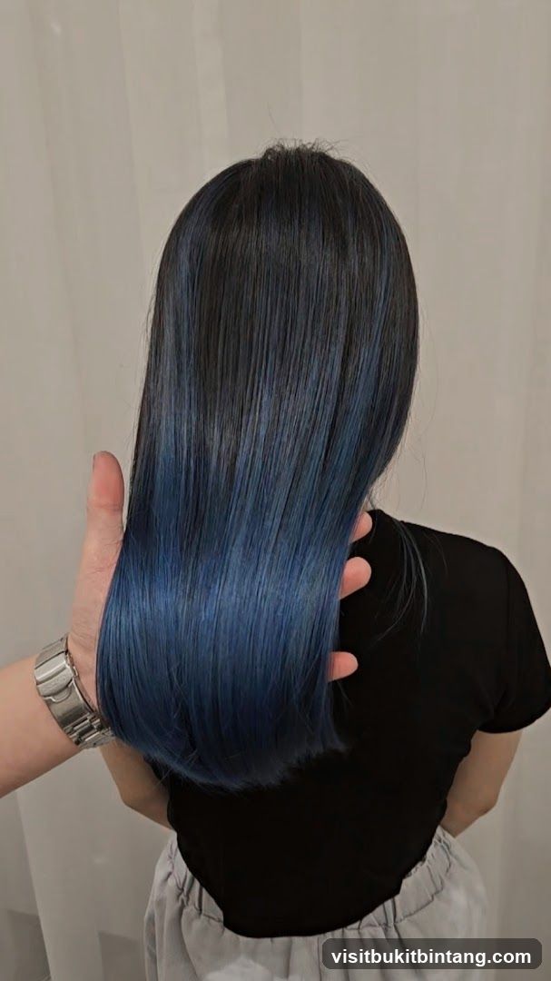 Woman with dark hair with blue ombre
