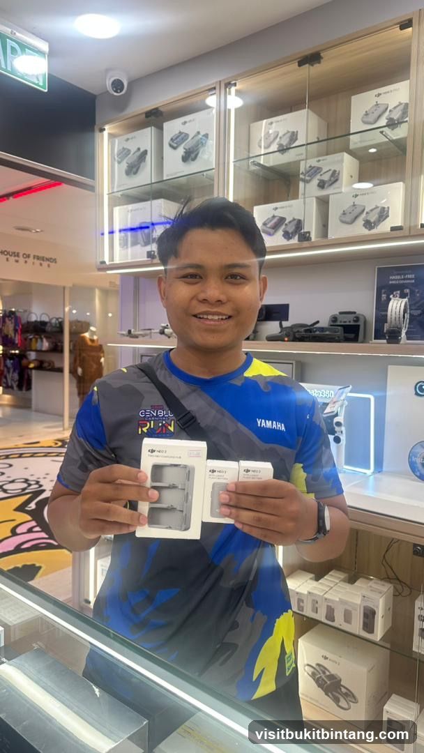 Person holding product boxes in store