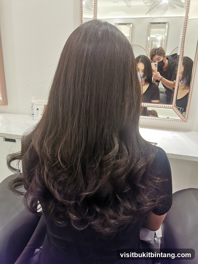 Hairdresser styling client's hair