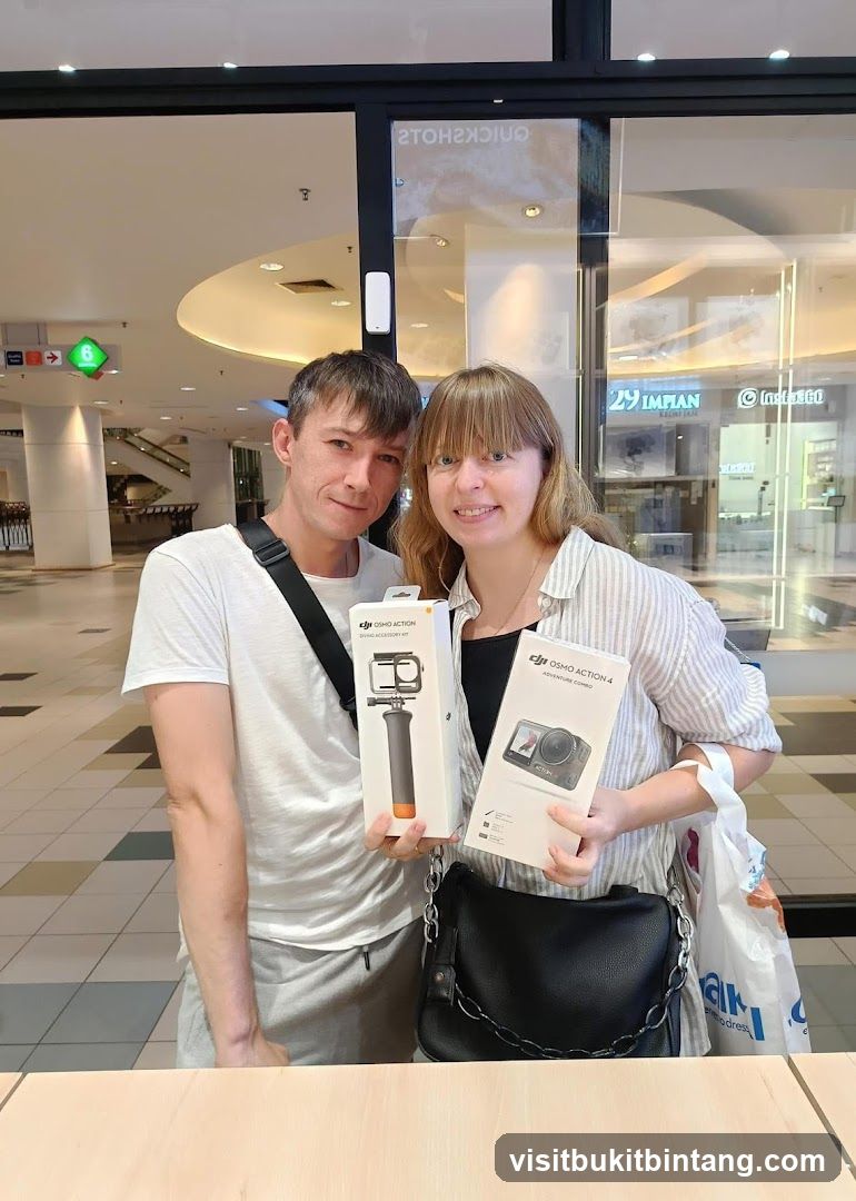 Couple with DJI products in mall