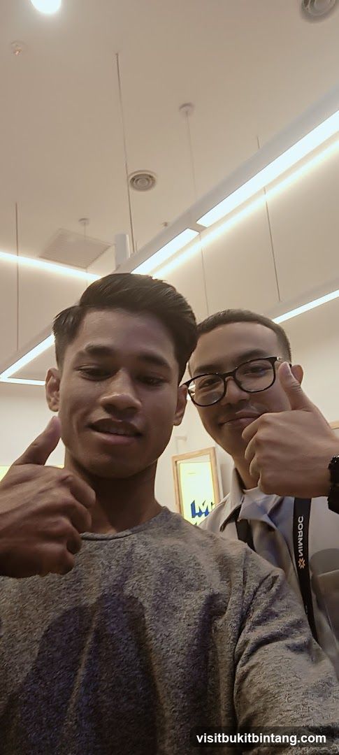Two men giving thumbs up