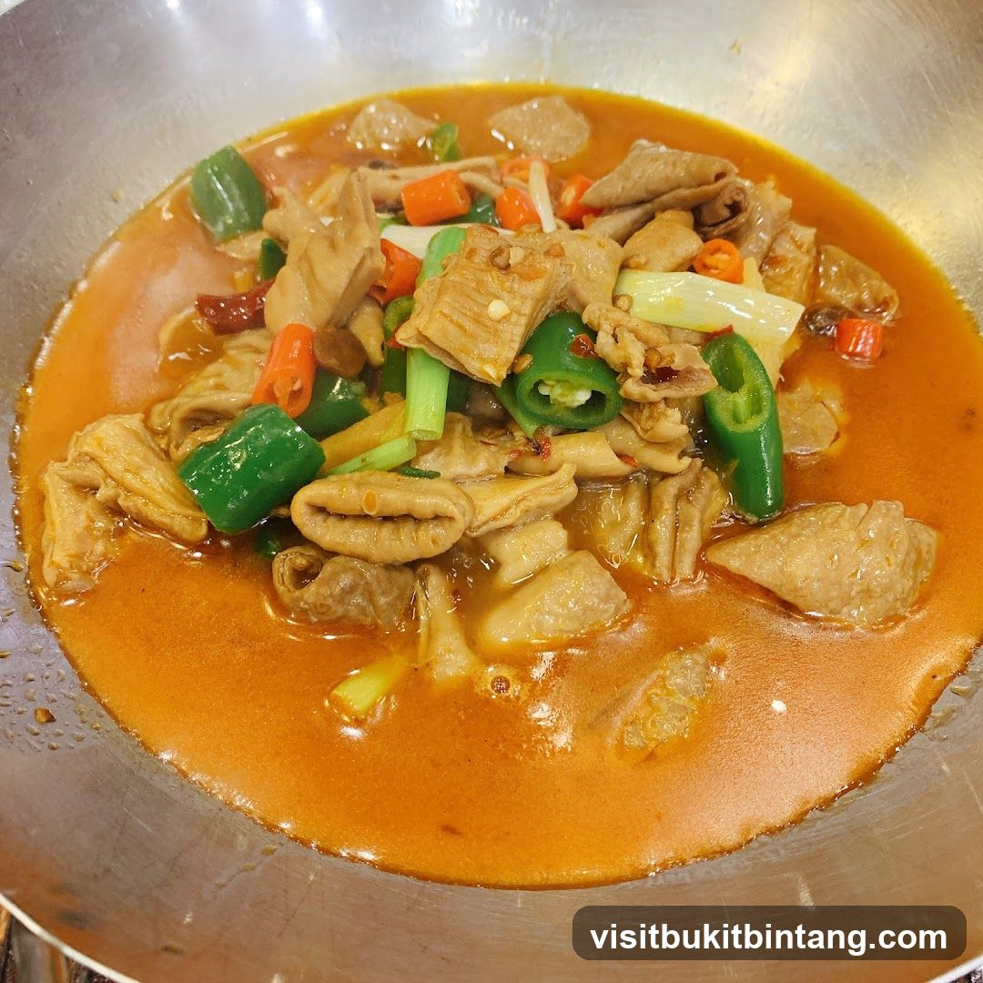 Stir-fried intestines with peppers and sauce