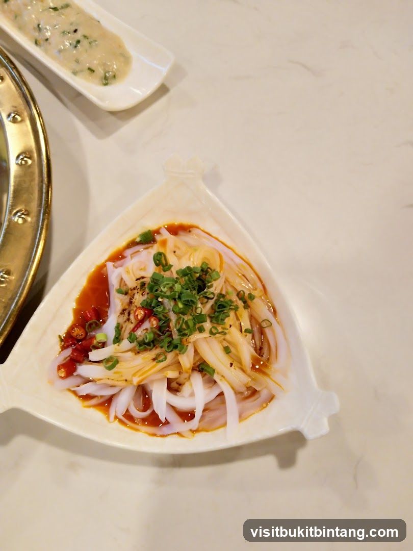 Dish with sliced ingredients and sauce