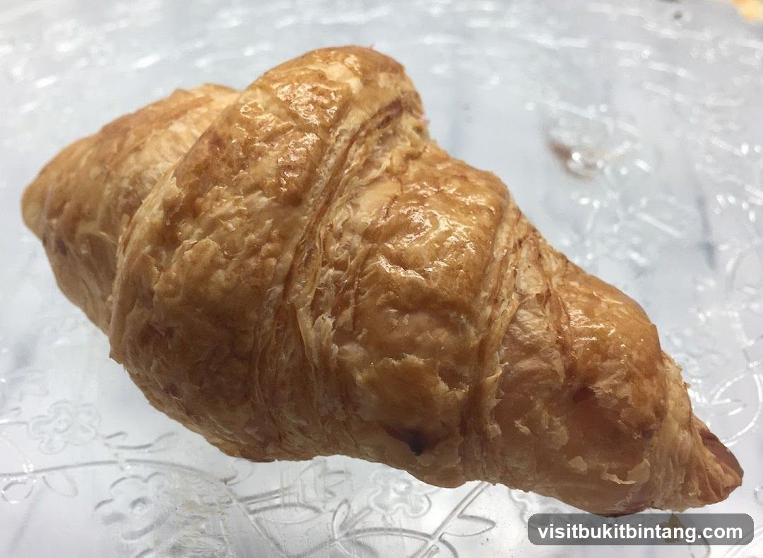 Croissant on Glass Plate