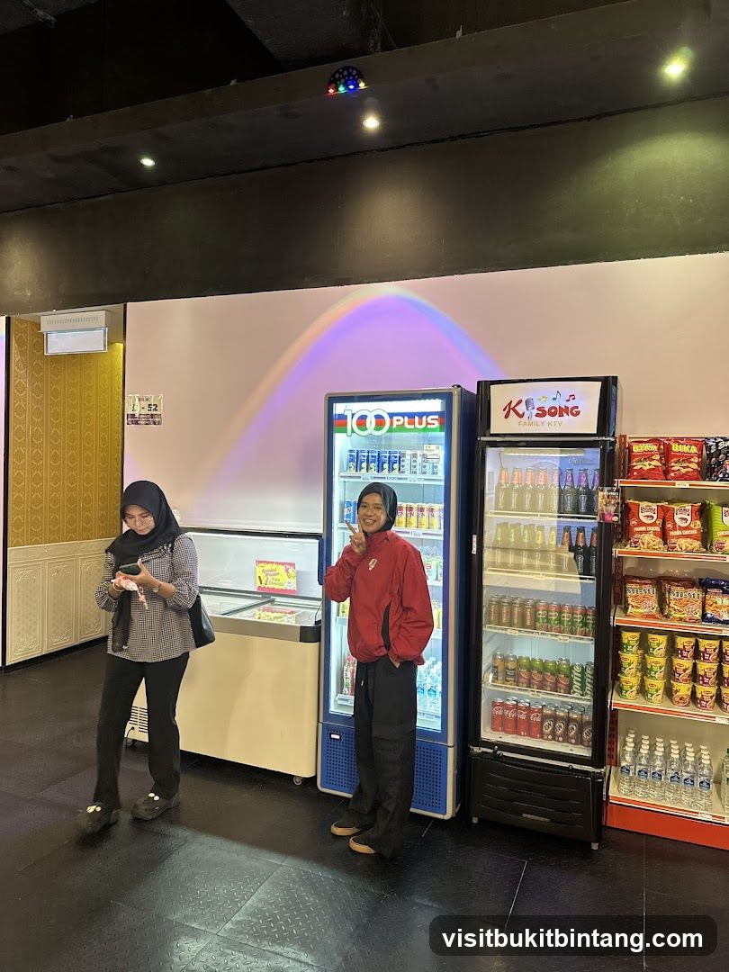 People in a store with refrigerators and shelves of snacks