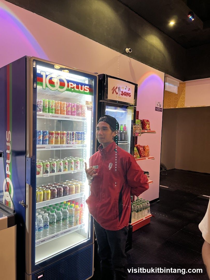 Staff Member by Refrigerated Drinks