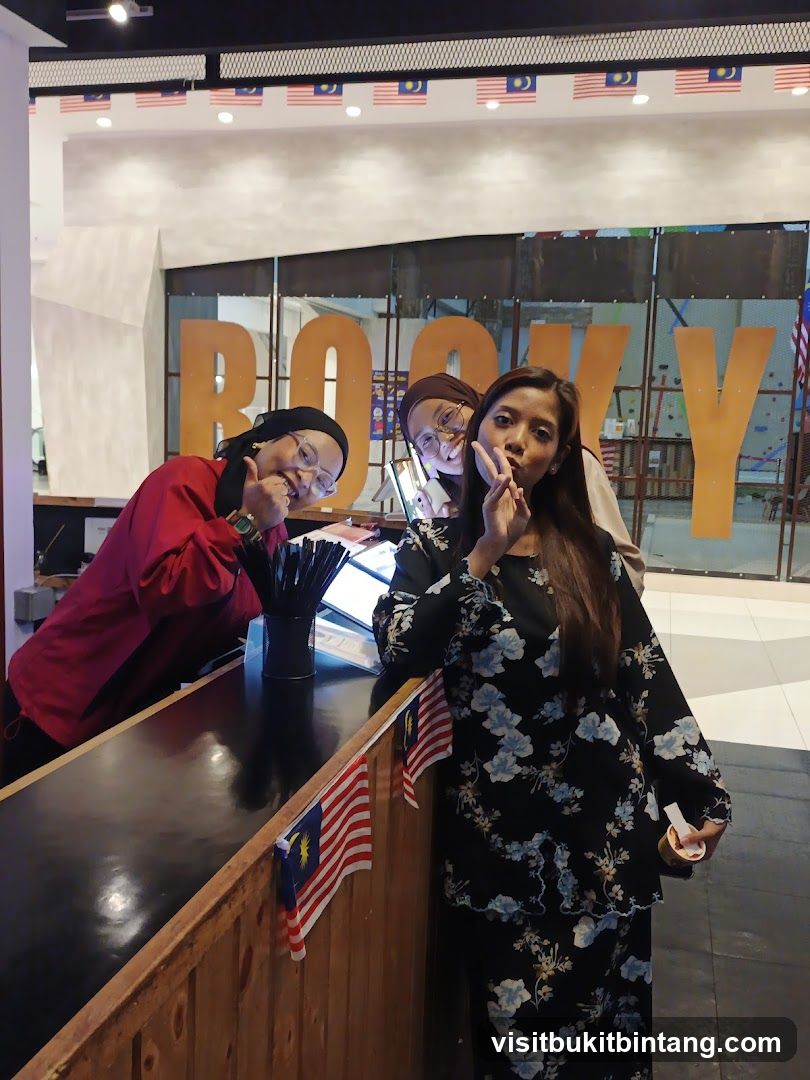 Three women posing at a counter
