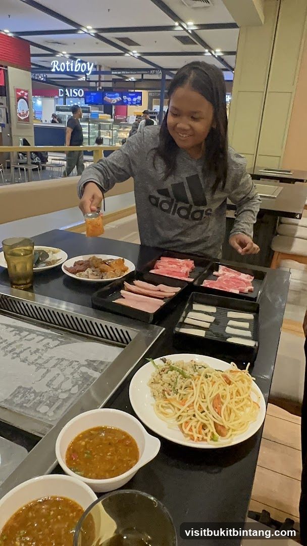 Girl at a Buffet