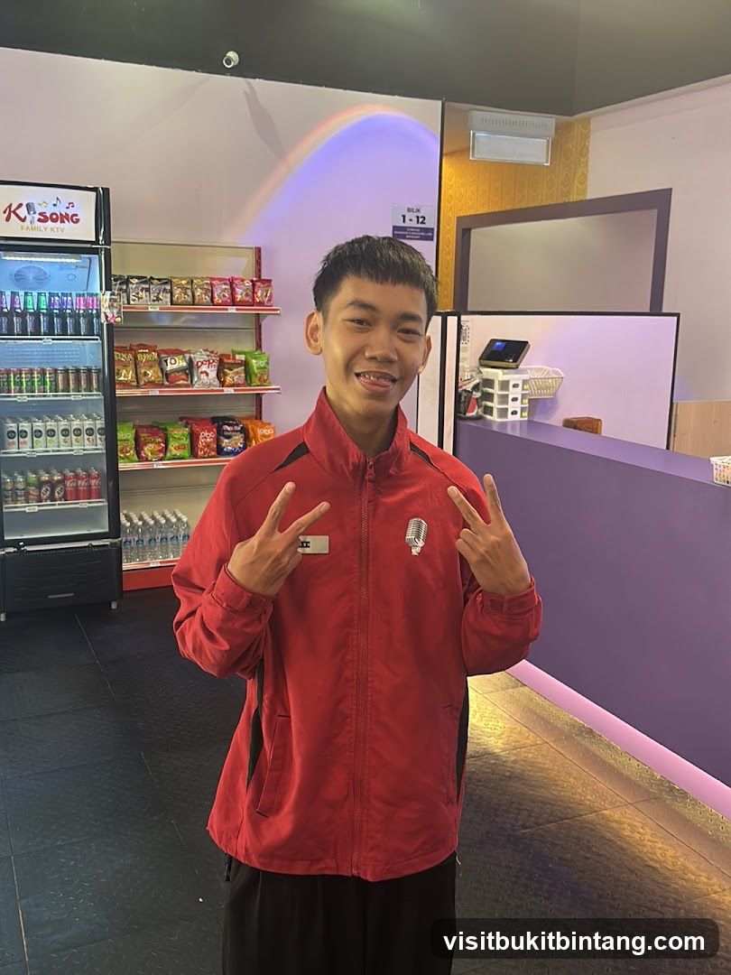 Young man in red jacket posing with peace signs