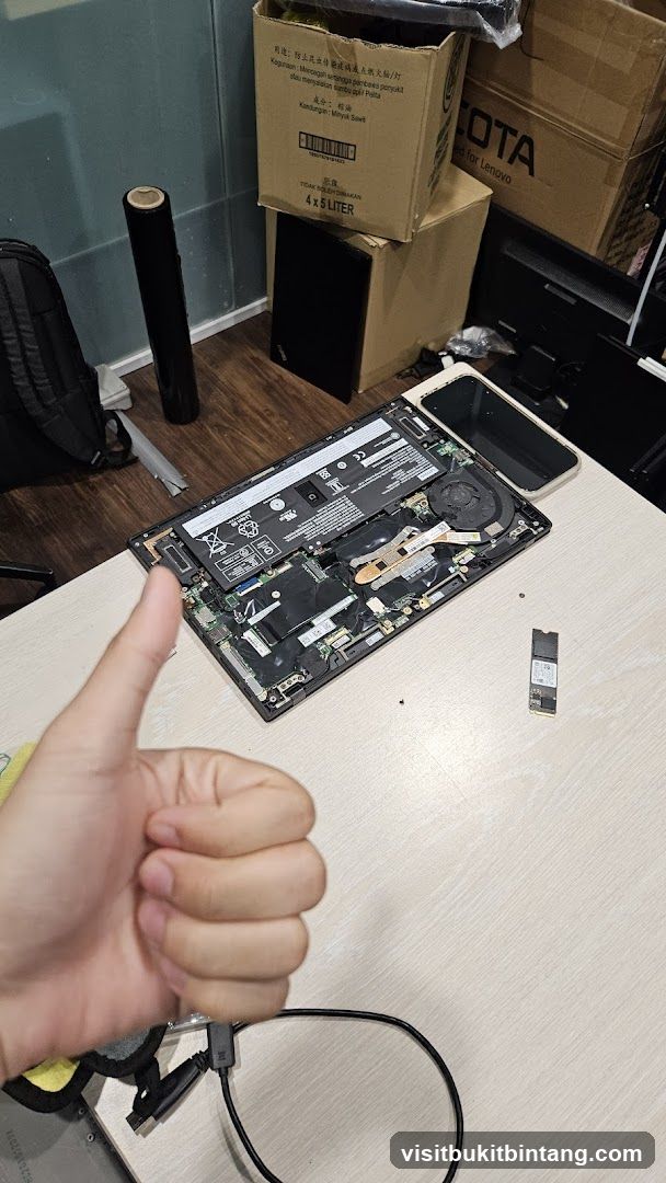 Disassembled Laptop on Workbench