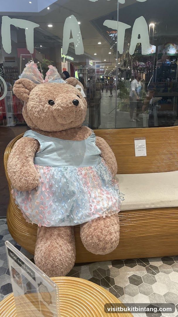 Giant Teddy Bear on Bench