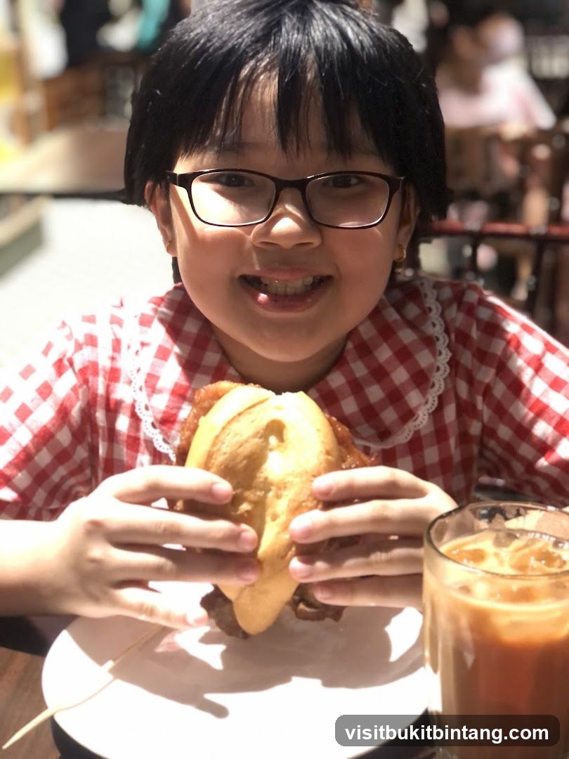 Girl with a sandwich and drink