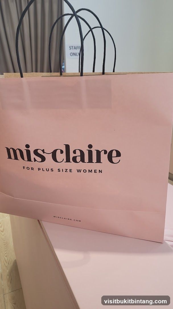 Pink shopping bag with "mis claire" logo