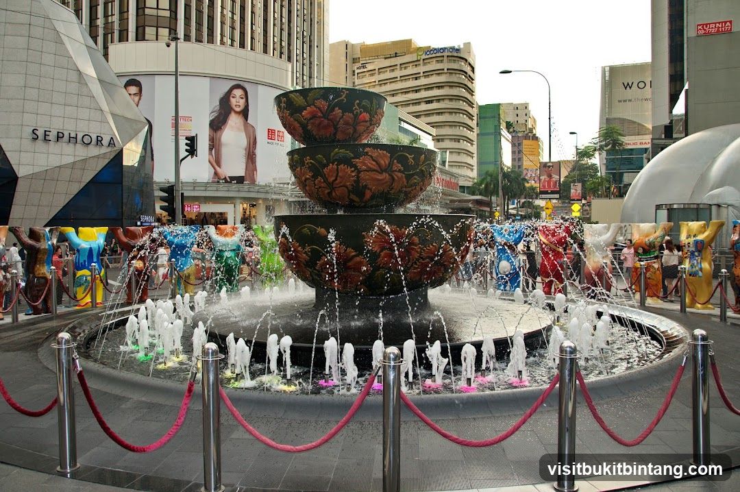 Urban Fountain Scene with Sephora Signage