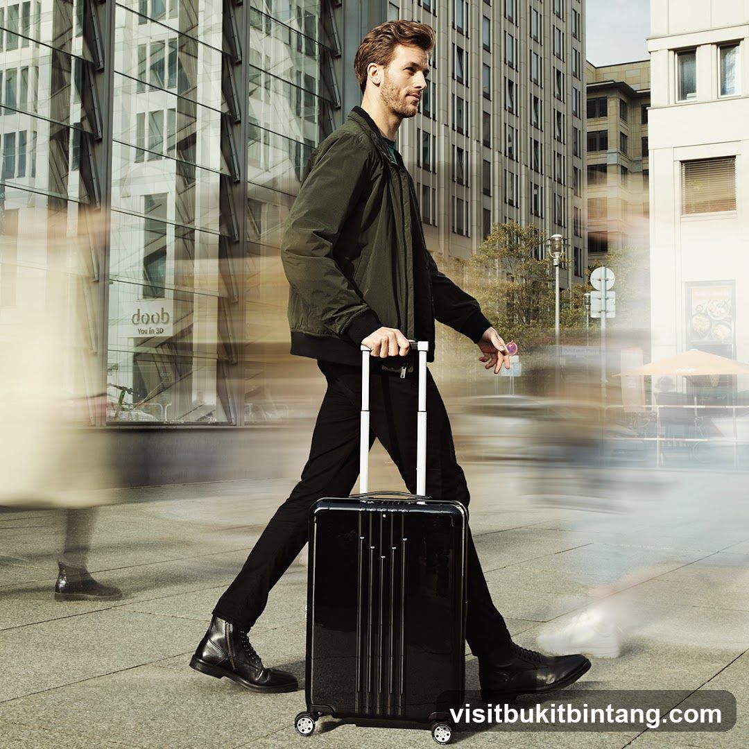 Man with suitcase in city