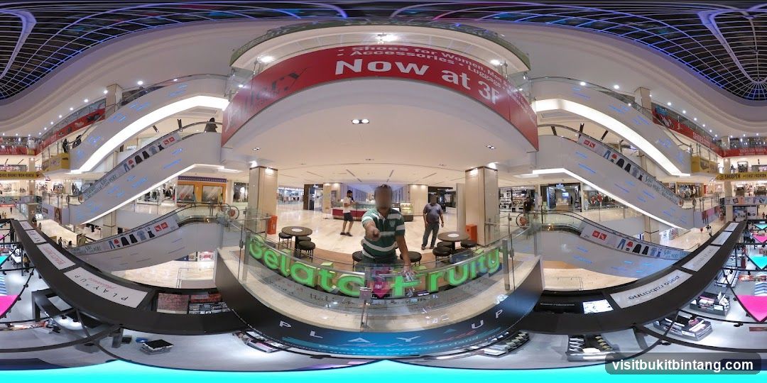 Mall Interior with Escalators and Shops