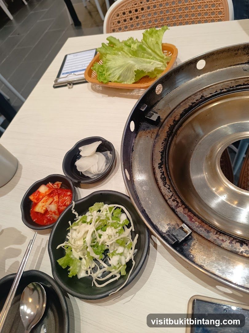 Table Setting with Korean Side Dishes and Grill
