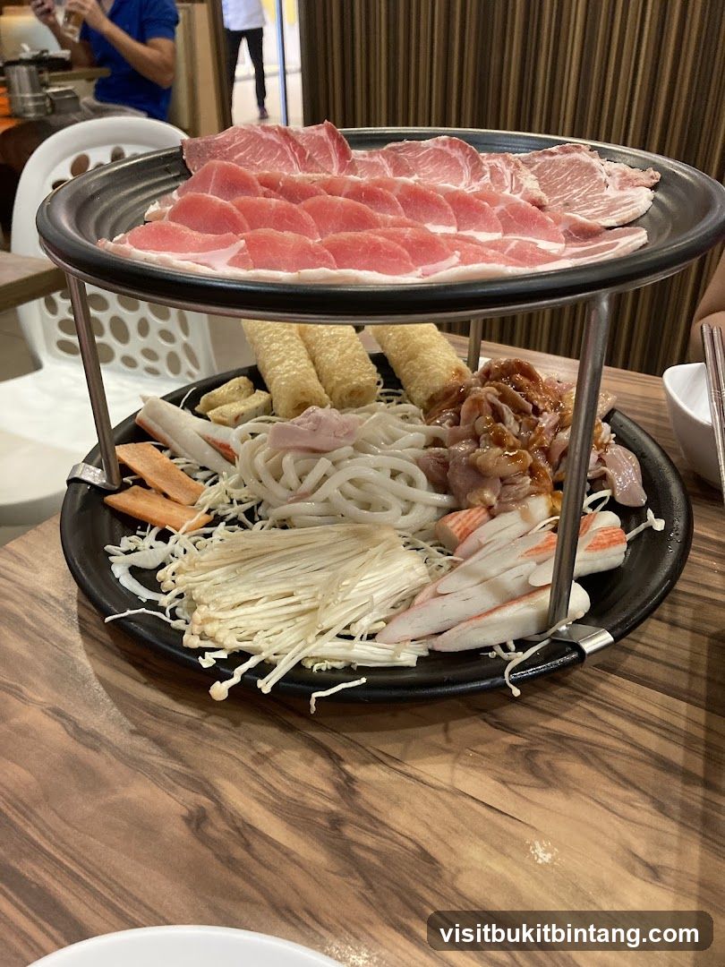Two-Tiered Platter of Raw Meats and Ingredients