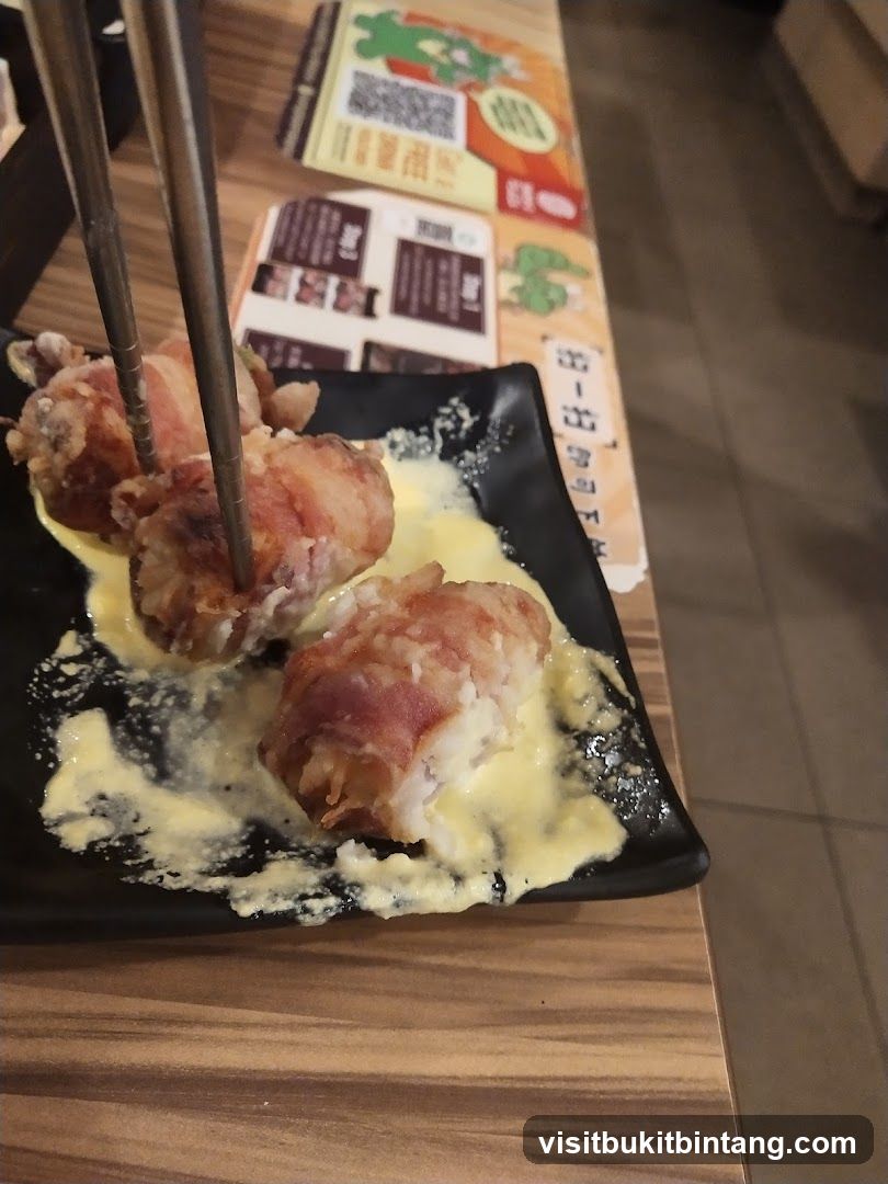 Bacon-wrapped food with sauce