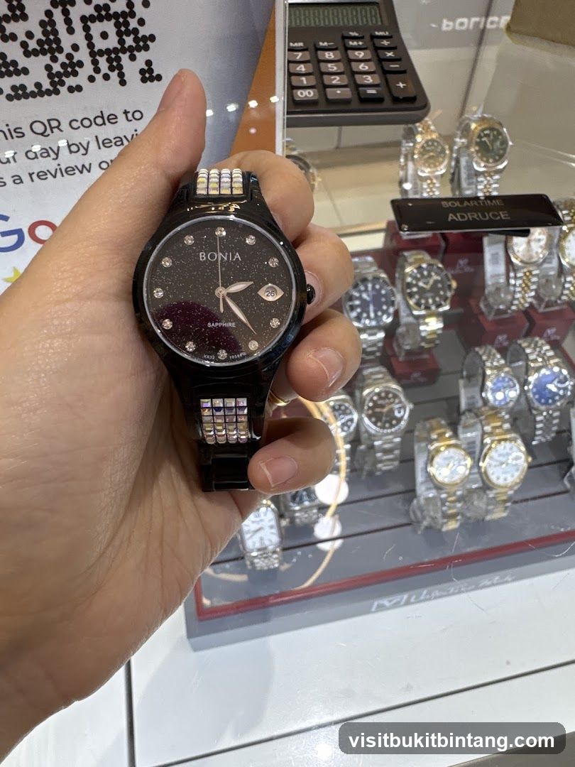 Person holding a watch in a store